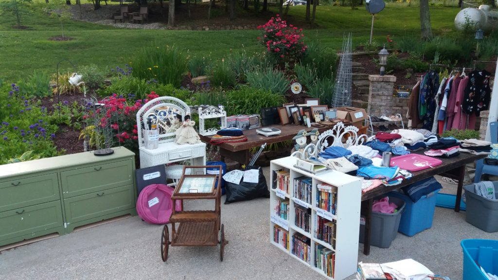 A picture of our annual yard sale. This particular sale was held late May - everyone was melting! | Effective Ways to Make Extra Money... For Travel